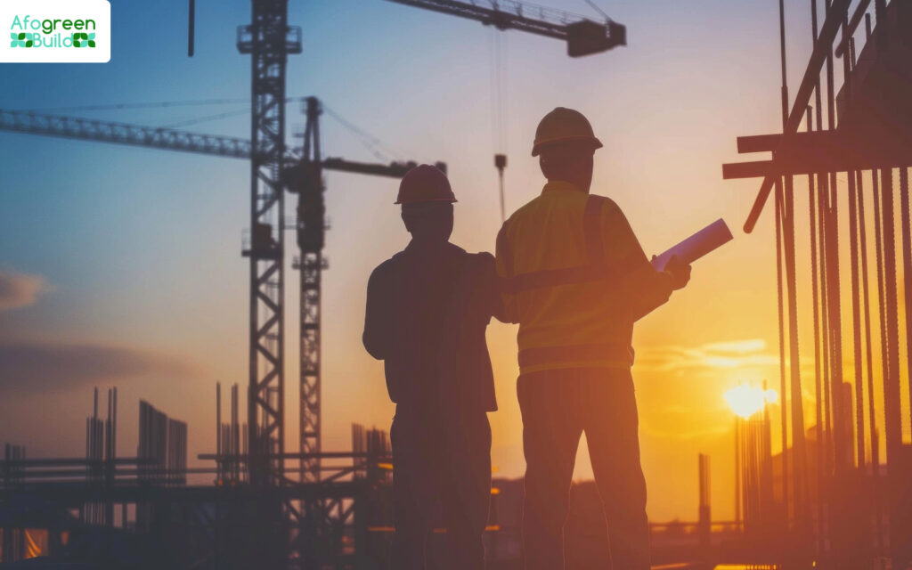 Two construction workers planning at a building site.